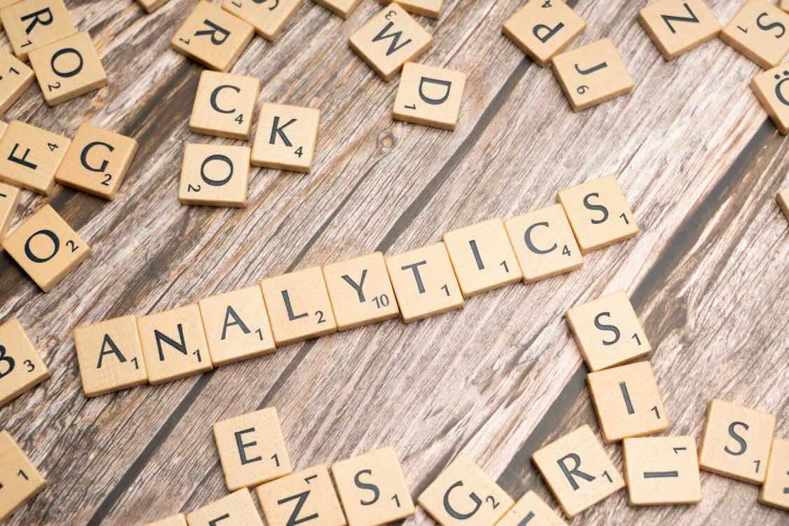 ‘analytics’ spelled out with Scrabble tiles