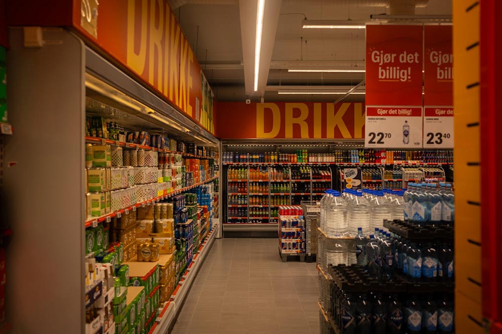 An image of a large-format grocery store with items stacked and and lined up on shelves
