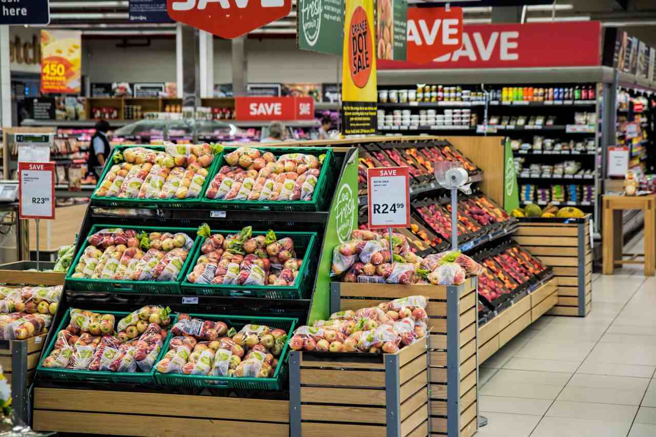 Image of a grocery store with produce and fruits stacked on shelves